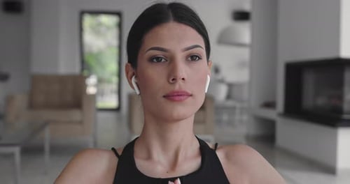 Woman Practicing Meditation at Home