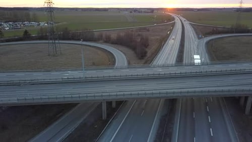 Aerial View of Freeway Intersection with Moving Traffic Cars