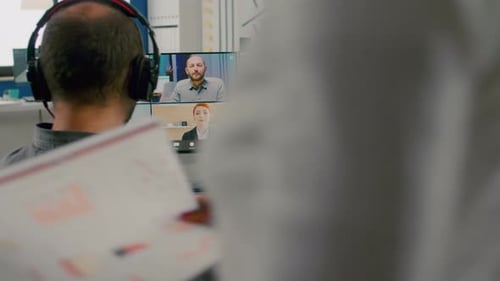 Video Editor Working at Computer Workstation