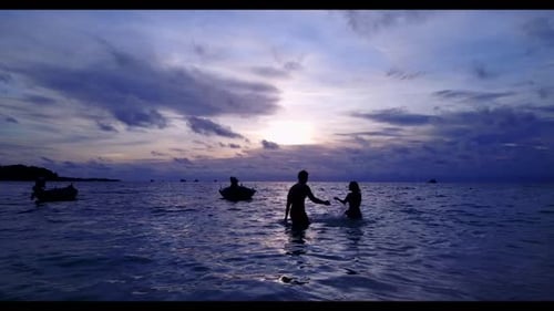 Romantic couple engaged on luxury shore beach trip by transparent lagoon and clean sand background o