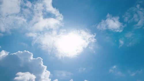 Clouds Moving Across a Bright Blue Sky