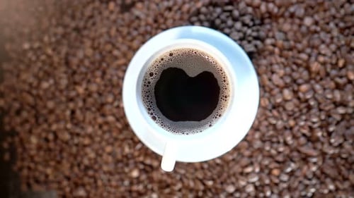 Coffee Cup on Coffee Beans Overhead
