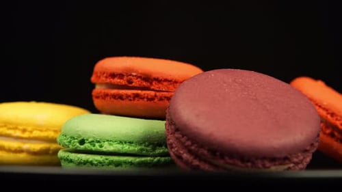 Colorful Macarons Close Up on a Black Background
