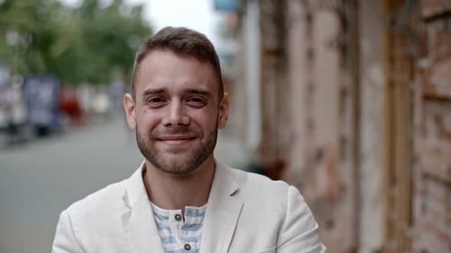 Handsome Man Smiling in City Setting