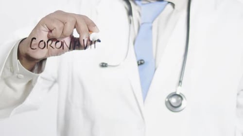 Doctor Writes Coronavirus on Glass Close Up