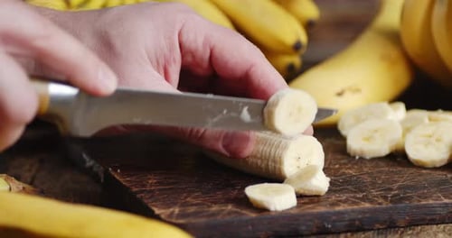 Banana Slices on Cutting Board in Close Up