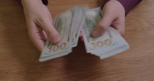 Hands Counting Hundred Dollars Money