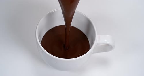 Chocolate Pouring into a Bowl, Slow Motion 4K
