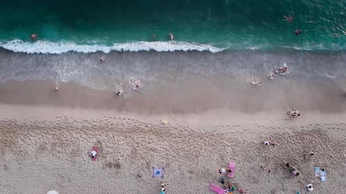 Aerial view sea coast tourist drone flying up of sandy beach. View of the beautiful beaches