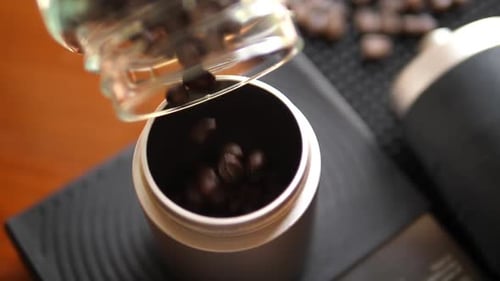 Coffee Beans Being Poured into Container