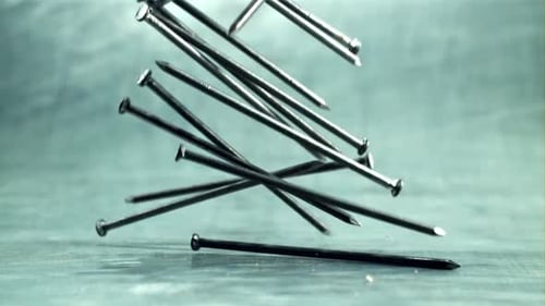 A Bunch of Nails Fall on the Table