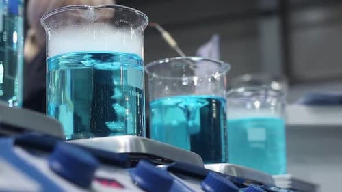 Blue Solution Experiments in Glass Beakers