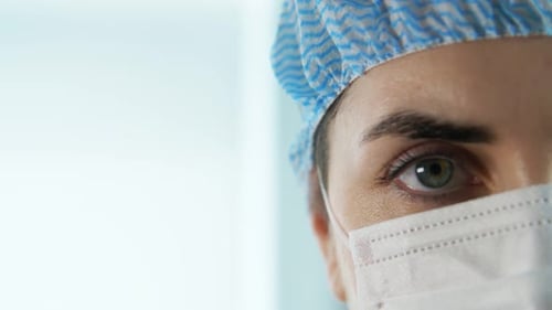 Close Up of Female Doctor or Nurse in Face Mask