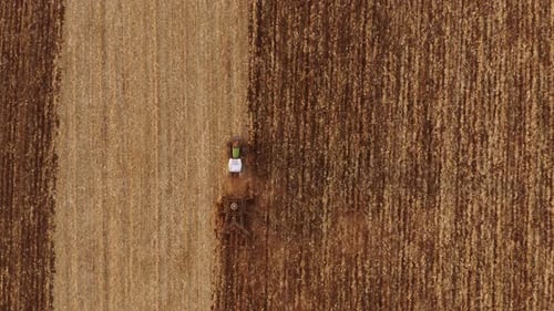 Aerial View Tractor Plowing Field