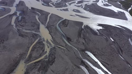 Flying Over a Glacial River and Moraine in Iceland
