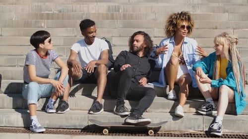 Stylish Young Friends Chatting on Street
