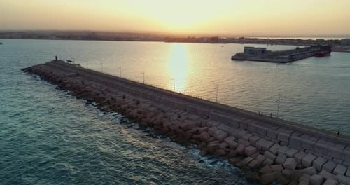 Drone Fly on Evening Over Mediterranean Sea and Pier at Sunset