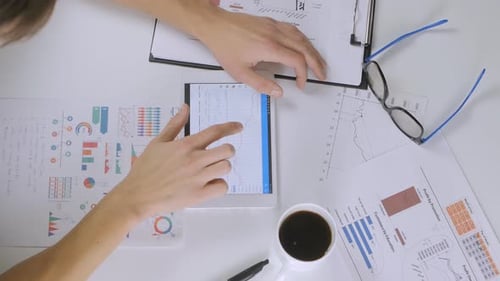 Man Do Business Project and Analyzing Market Data Information on Tablet Computer