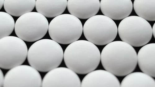 Close Up of Many Pills and Tablets Turning