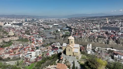 Aerial view of Old Tbilisi in the center of city. Morning cityscape of capital of Georgia 2022