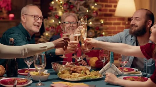 Family Toasting Champagne at Festive Christmas Dinner