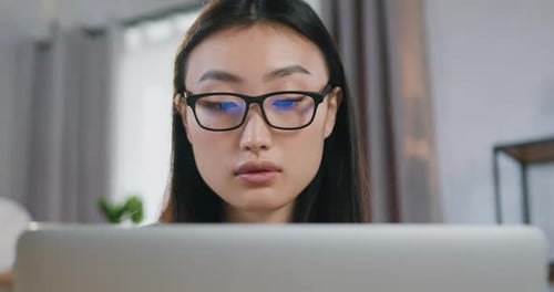 Woman Works On Laptop at Home Close Up