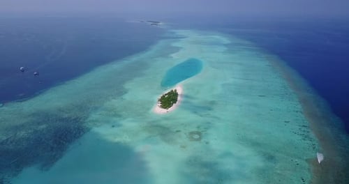 Wide fly over tourism shot of a white paradise beach and turquoise sea background in high resolution