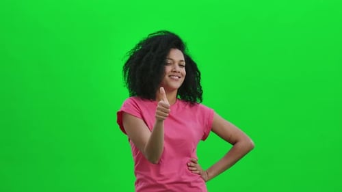 Enthusiastic Woman Gives Thumbs Up on Green Screen
