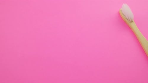 Colorful Toothbrushes on Pink Background, Dental Care