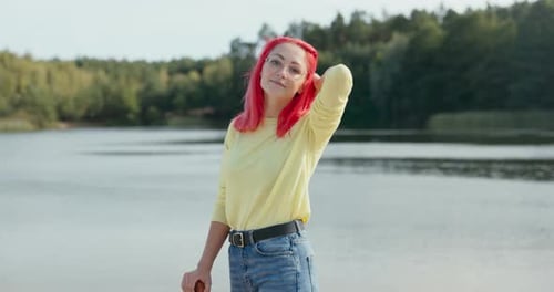 Young Woman with Pink Hair Posing by Lake