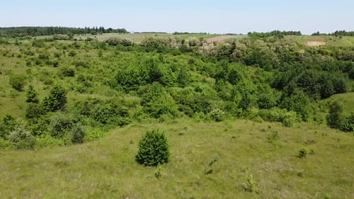 Aerial drone view of a flying over the rural agricultural landscape.