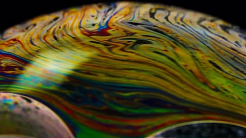 Abstract Iridescent Patterns on a Soap Bubble