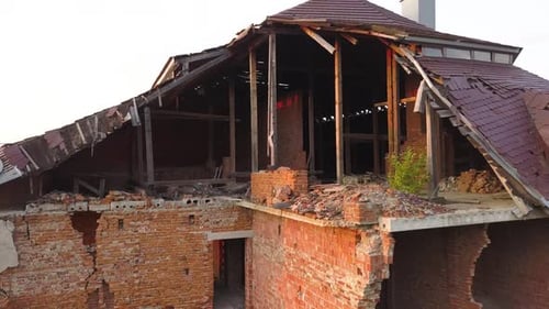 Aerial view of an old ruined building after earthquake. A collapsed brick house.