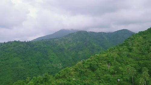 Drone Fly Over Tropical Mountains Covered with Forest and Lush Greenery.