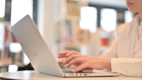Female Hands Typing on Laptop Keyboard Close Up