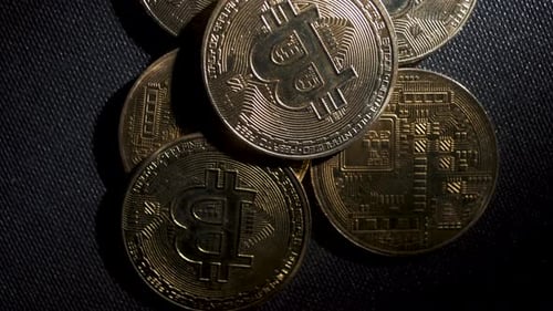 Golden Bitcoin Coins on a Dark Background