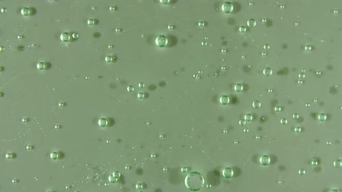 Green Liquid Cream Cosmetic Gel Fluid Motion Rotation on a Surface