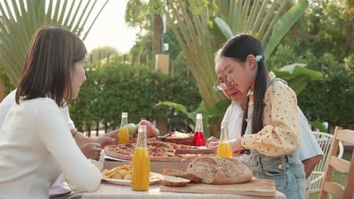 Happy Family Picnic in Sunny Garden Setting