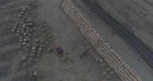 Field with bales of hay seen from above