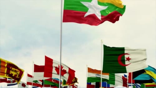 Waving Flags of Many Nations with Myanmar in Focus