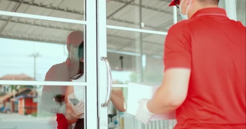 Woman Receives Box Delivery at Front Door