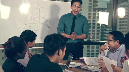 Asian Business People Discuss Marketing Strategy
