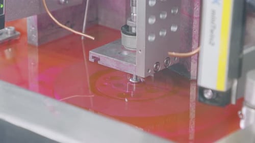 Advanced robotic machine manufacturing parts in an automated assembly line