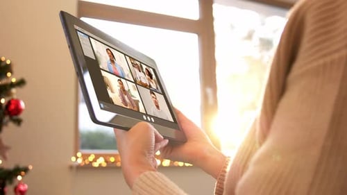 Woman Video Chats on Tablet at Christmas