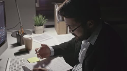 Man Analyzing Financial Data