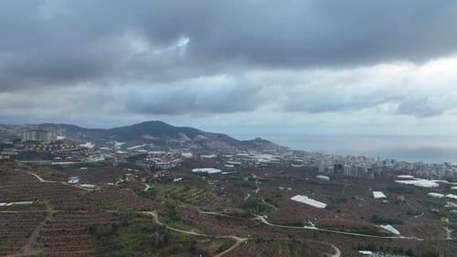 Over the city in the clouds aerial view 4 K