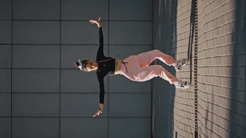 Young Woman Dancing Outdoors Urban Bird's Eye View