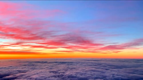 Colorful Sunrise Above a Sea of Clouds