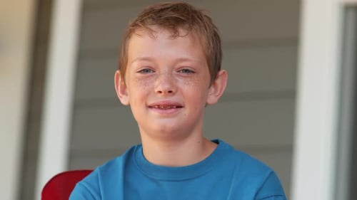 Boy Waving American Flags, Close Up on Porch