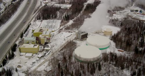 Helicopter aerial of mountain landscape from above clouds, day